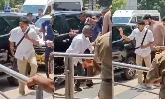 എയർപോട്ടിൽ  ആരാധകനു നേരെ തോക്കു ചൂണ്ടി വിജയിയുടെ ബോഡി ഗാർഡ് എയർപോട്ടിൽ  ആരാധകനു നേരെ തോക്കു ചൂണ്ടി വിജയിയുടെ ബോഡി ഗാർഡ്